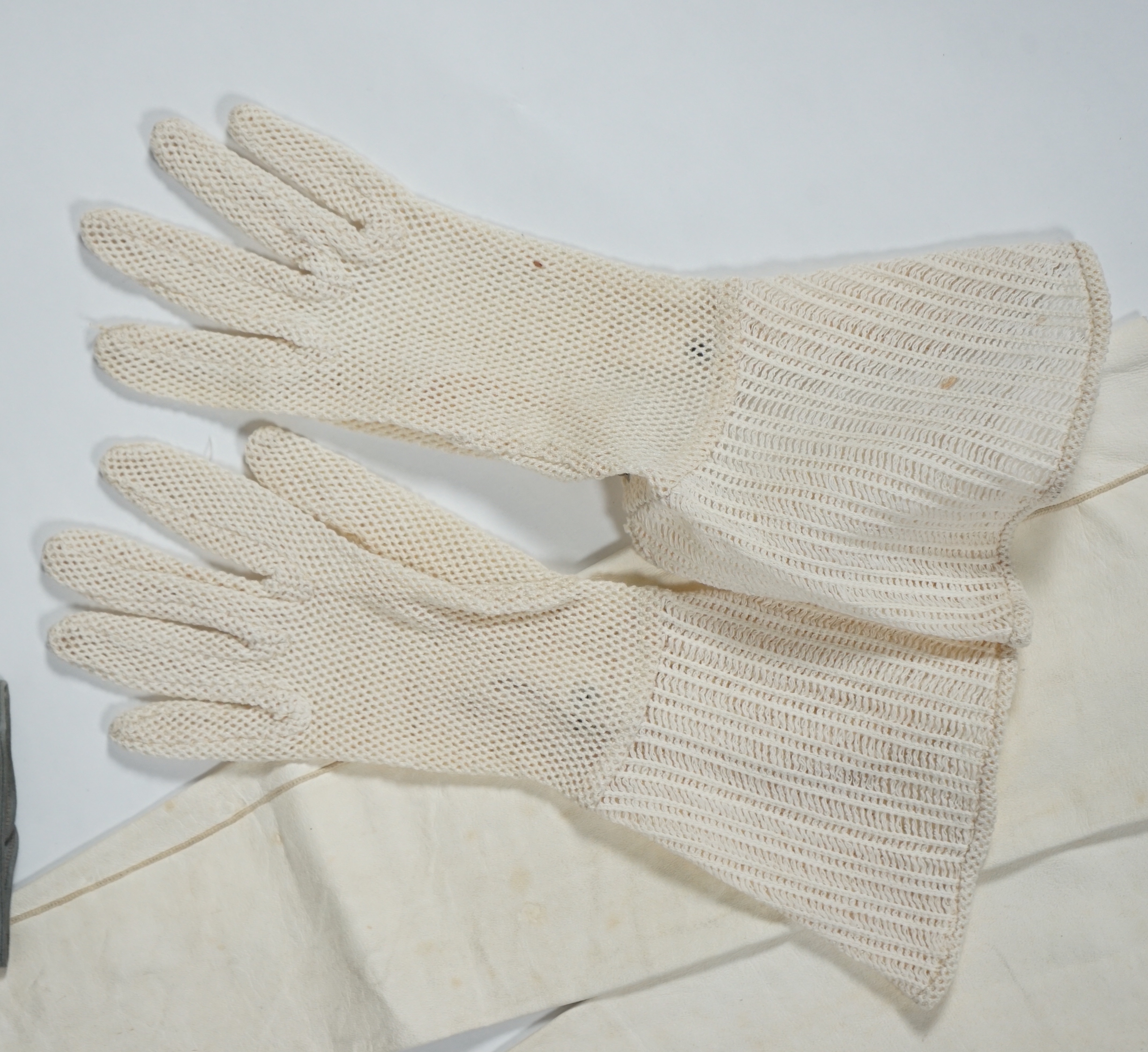 A pair of lady's Hermès skin gloves, boxed and three other pairs of gloves